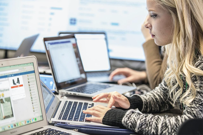 Woman typing on computer