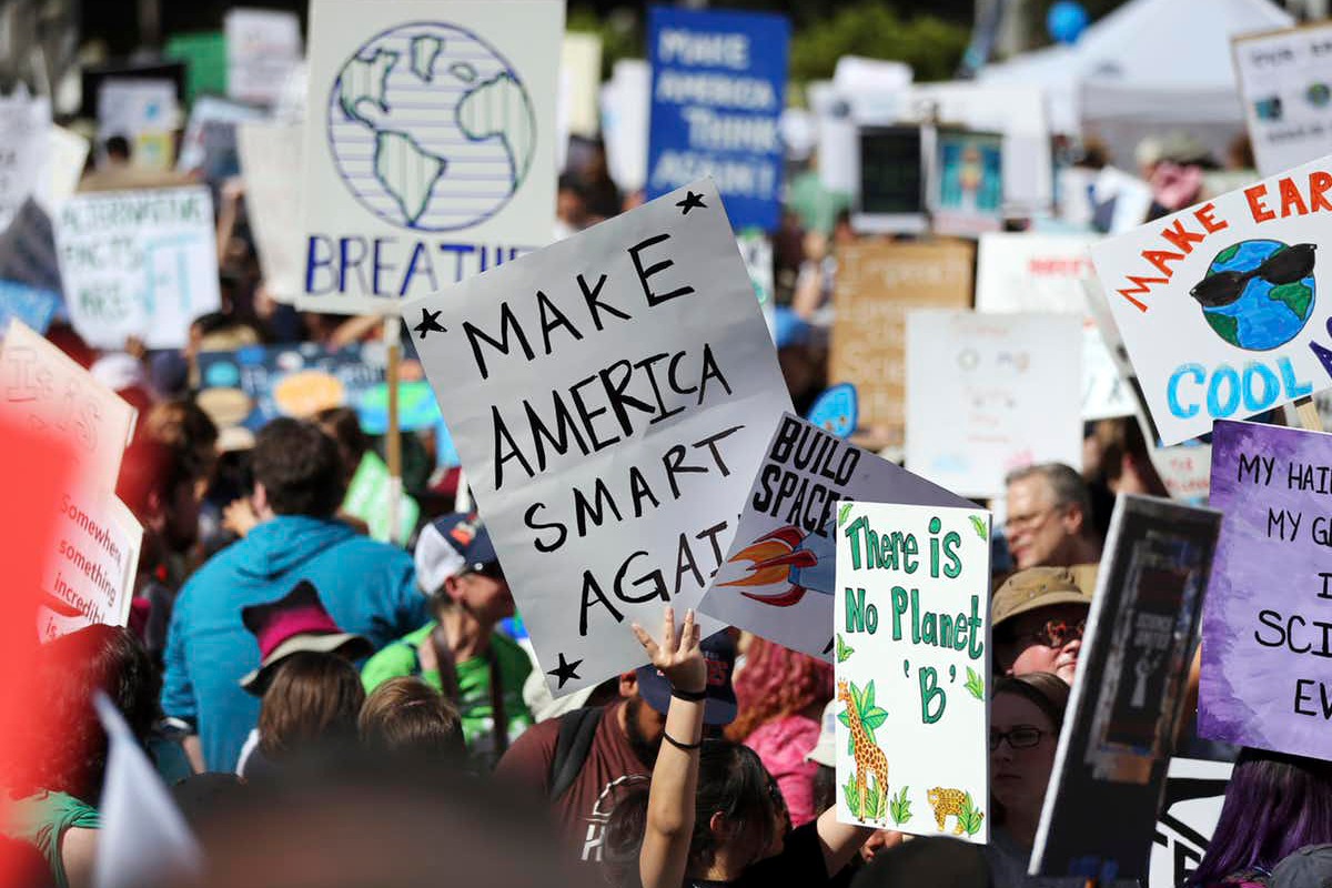protestors with signs rallying for science