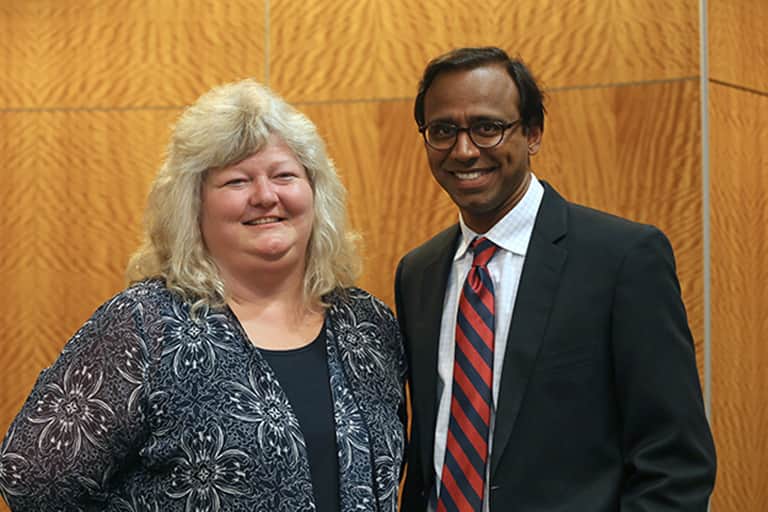 ComArtSci professor and Director of the Sparrow/MSU Center for Innovation and Research (CFIR), Shelia Cotten standing next to Dean Prabu David in ComArtSci lobby on the first floor. Prabu David is also Chair of the Governing Board for the CFIR.