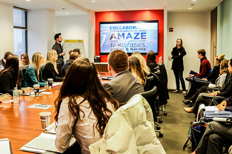Student giving a presentation to a group